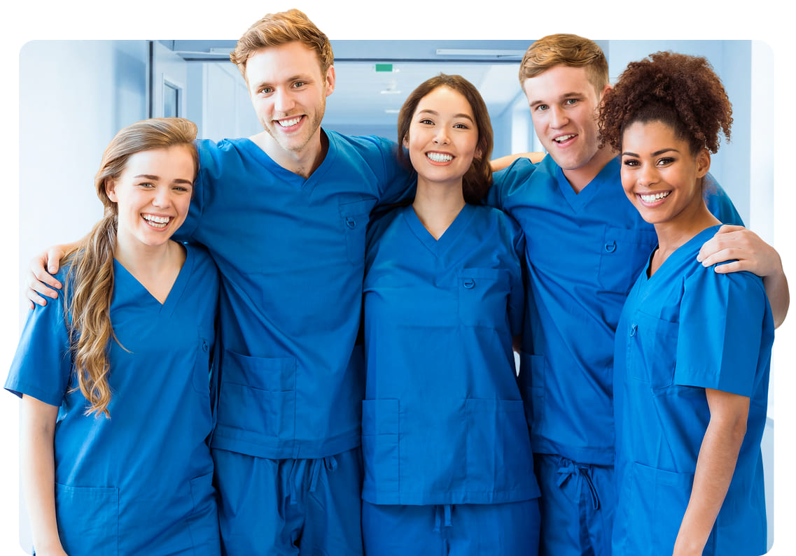 Group of five nurses in blue scrubs who passed the NCLEX exam